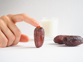 Sweet food for ramadan. Conceptual photo of Ramadan food:dates palm and milk.

