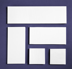 Blank flyer poster over purple background to replace your design.