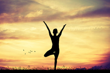 yoga pose at sunset - obrazy, fototapety, plakaty