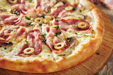 Pizza Restaurant Menu - Delicious Fresh Pizza with Bacon and Olives. Pizza on Rustic Wooden Table with Ingredients