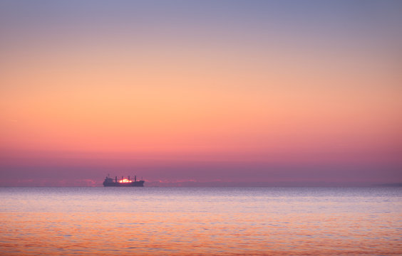 boat in the sea at sunset