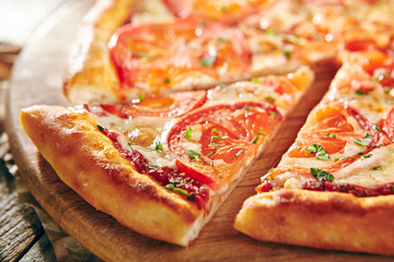 Pizza Restaurant Menu - Delicious Fresh Margarita Pizza with. Pizza on Rustic Wooden Table with Ingredients