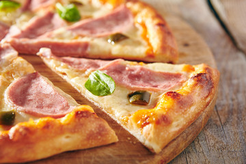 Pizza Restaurant Menu - Delicious Fresh Spicy Pizza with Ham and Chili Pepper. Pizza on Rustic Wooden Table with Ingredients
