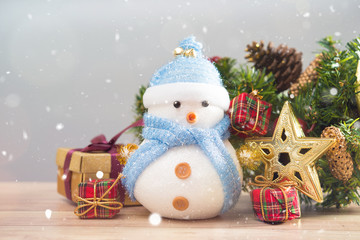 Happy snowman standing in winter christmas snow background. Merry christmas and happy new year greeting card with copy space. Christmas celebration holiday background.