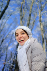 Outdoors Close Up Portrait of Smiling Woman Wearing White Hat and Scarf.