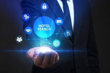 Business, Technology, Internet and network concept. Young businessman working on a virtual screen of the future and sees the inscription: Hotel search