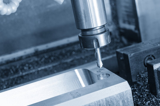 The center drill tool on the CNC milling machine in blue scene.