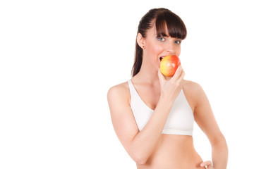 beautiful young woman with slim body in underwear eating an apple isolated