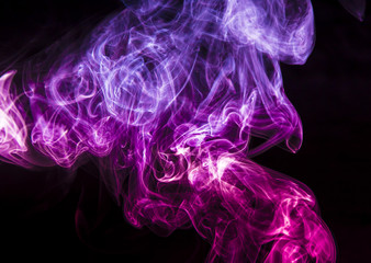 Obraz premium Colored smoke on black background