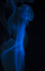 Blue smoke on black background