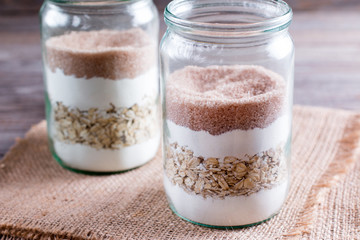Brown sugar in a jar. Mixing of ingredients for cookies in a jar