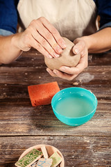woman potter sculpts