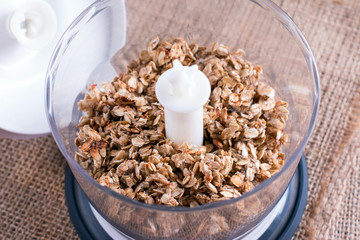 Granola in a blender. Healthy food concept.