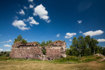 Summer view to castle ruins in Buchach with beautiful sky and clouds, Ternopil region, Ukraine