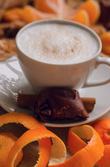 Christmas concept, cup of coffee with cookie, anis, canella  and orange zest