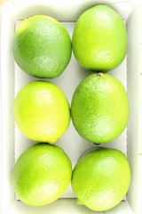 fresh lime fruits in a box