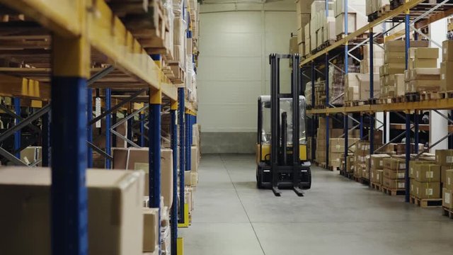 An interior of a warehouse with forklift.