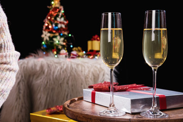 Happy Relaxing at party, Two champagne glasses and sparkle, Christmas tree ornament on the background