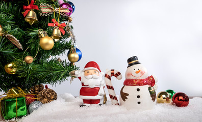 Christmas decoration Holiday or new year with Santa Claus and snowman on snow background and copy space