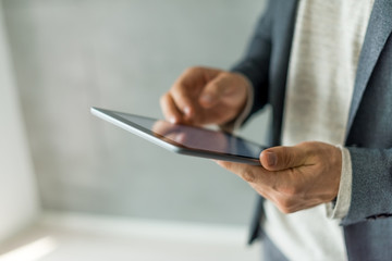 Businessman holding digital tablet