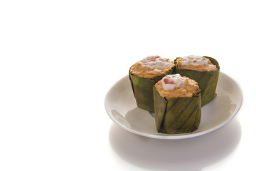 steamed fish with curry paste on white dish isolated on white background, Free from copy space. Thai food style..