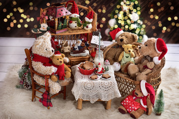 teddy bear family at christmas time with milk and cookies
