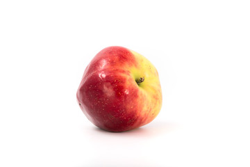a large red ripe apple on white. Studio.