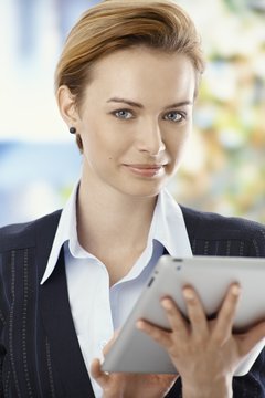 Beautiful businesswoman using tablet pc