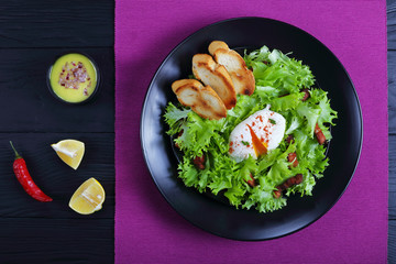 lettuce, crispy bacon and a poached egg salad
