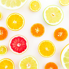Fototapeta na wymiar Citrus fruit pattern made of lemon, orange, grapefruit, sweetie and pomelo on white background. Juicy concept. Flat lay, top view.