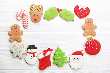  Christmas homemade gingerbread cookie frame on wooden table top view with copy space