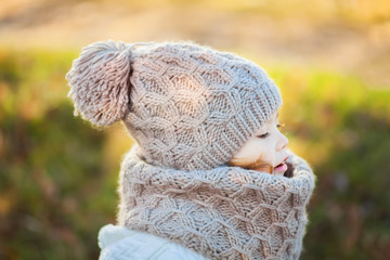 Autumn outdoor, toddler girl walking outdoors.