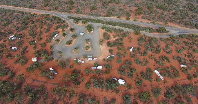 Aerial views of Grey Nomads free camping with cars and caravans at Nerren Nerren Station between Geraldton and Carnarvon in Western Australia 