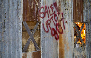 Background of galvanized metal sheet with graffiti sale up to 80%. Rusty galvanized metal sheet wall