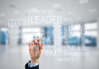 Concept of modern business with palm choocing on of keywords for success