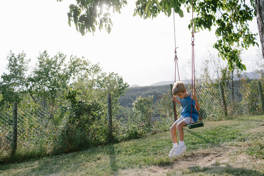 Boy having fun on swings
