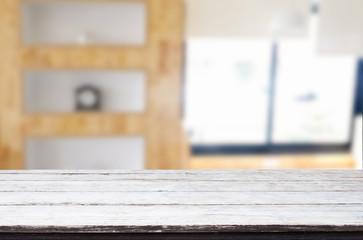 Empty of wood table top on blur of window glass in the morning background. for your photomontage or product display.