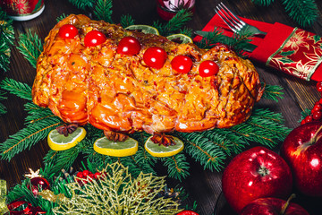 Thanksgiving day. Christmas table dinner time with roasted meats decorated in Christmas style. The concept of a family holiday. Beautiful delicious food background