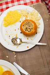 children prepare a stuffed bun of raw ingredients