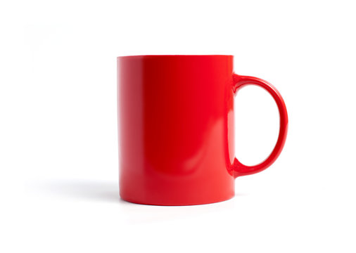 Closeup of red mug on a white background.