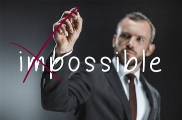caucasian businessman with pen
