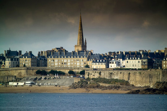Waterfront view of beach townhouses and skyline, Saint-Malo, Brittany, France