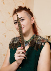 The girl shows ornaments from macrame