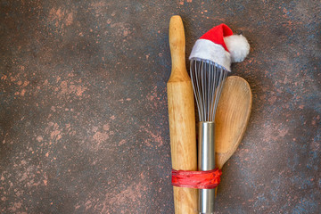 Accessories for New Year's Christmas buns whisk in a santa cap, rolling pin, spoon and eggs,...