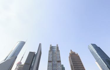 Fototapeta na wymiar Office buildings in modern city with blue sky