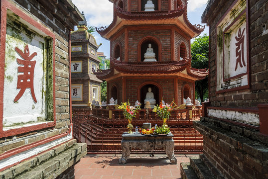 altar and tower in the pagoda Tran Quoc in the lake Ho Tay in Hanoi, Vietnam.