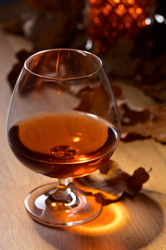 Brandy and dried up oak leaves .
