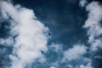 the plane is high in the sky
