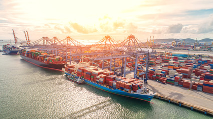 Fototapeta premium container,container ship in import export and business logistic,By crane,Trade Port , Shipping,cargo to harbor.Aerial view,Water transport,International,Shell Marine,transportation,logistic,trade,port