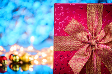 gifts and toys on glass table and bokeh blue light background